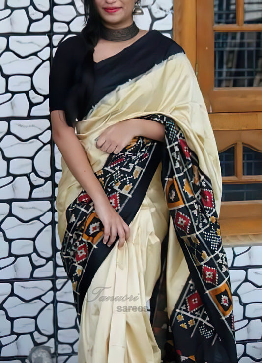 Sophisticated Simplicity Cream and Black Ikat Patola Silk Saree