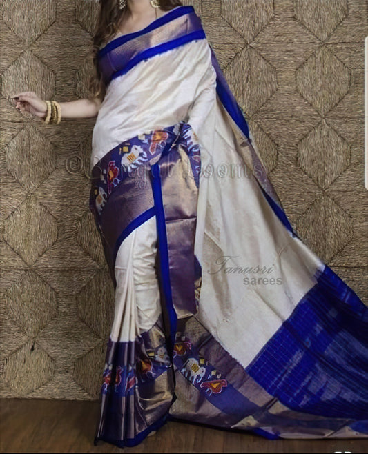 Whispering Sky: The Off-White and Blue Ikat Patola Silk Saree