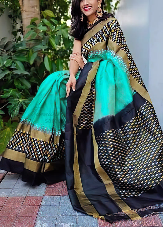 Oceanic Allure Sea Green and Black Ikat Patola Silk Saree